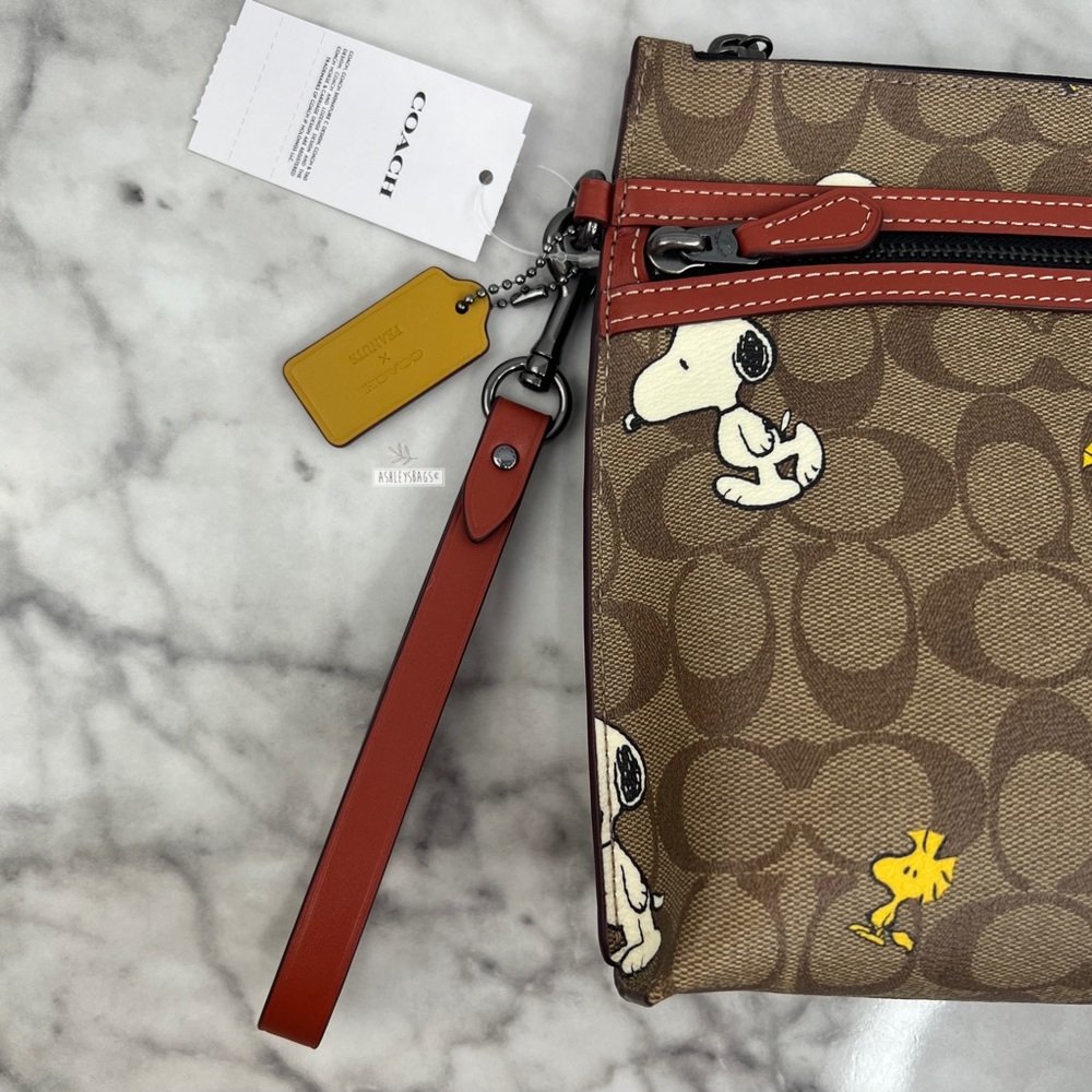 Coach X Peanuts Carry All Pouch In Signature Canvas With Snoopy Woodstock Print - Picture 2 of 11